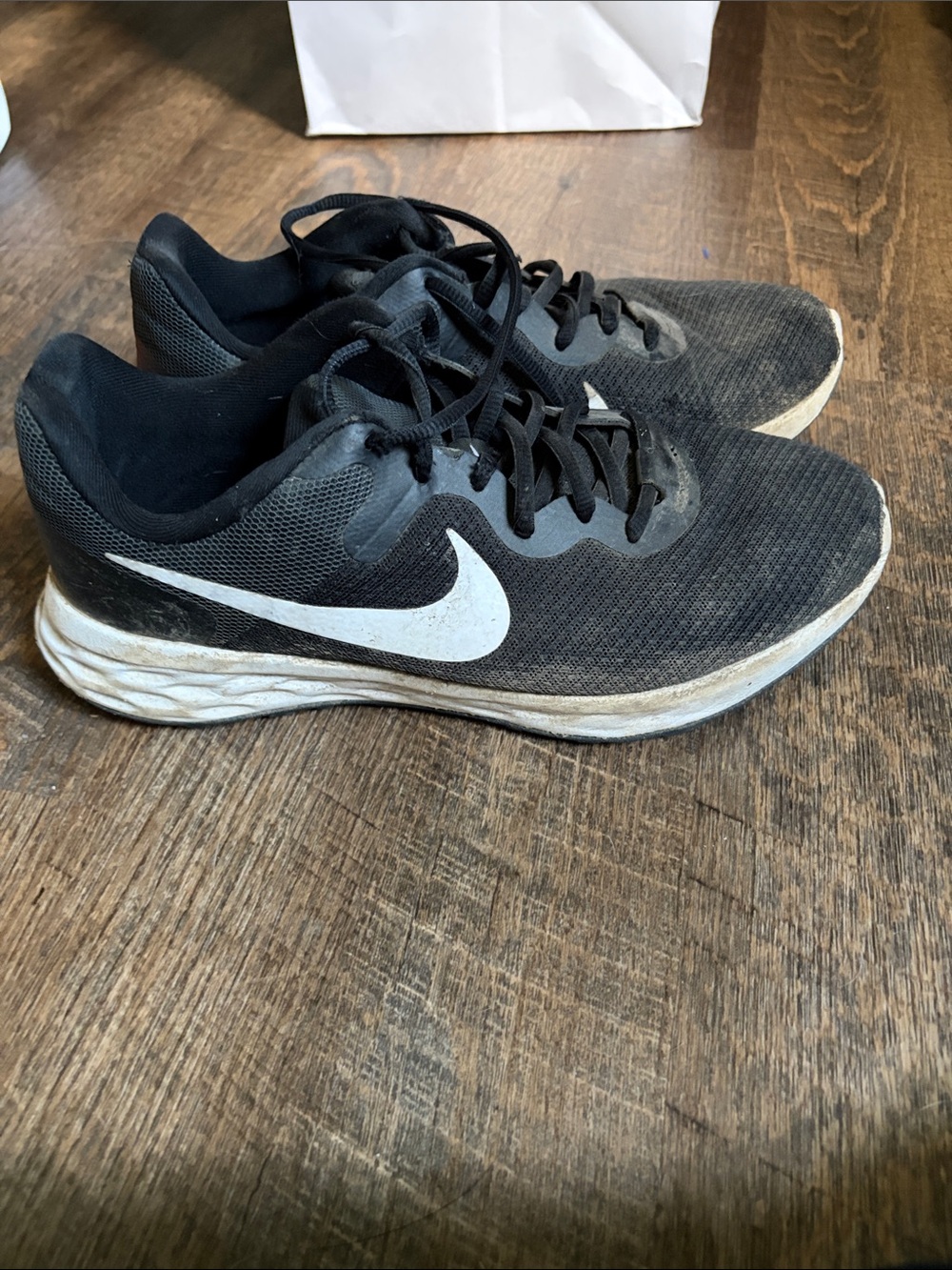 Nike women’s Black Athletic Running Shoes with White Swoosh